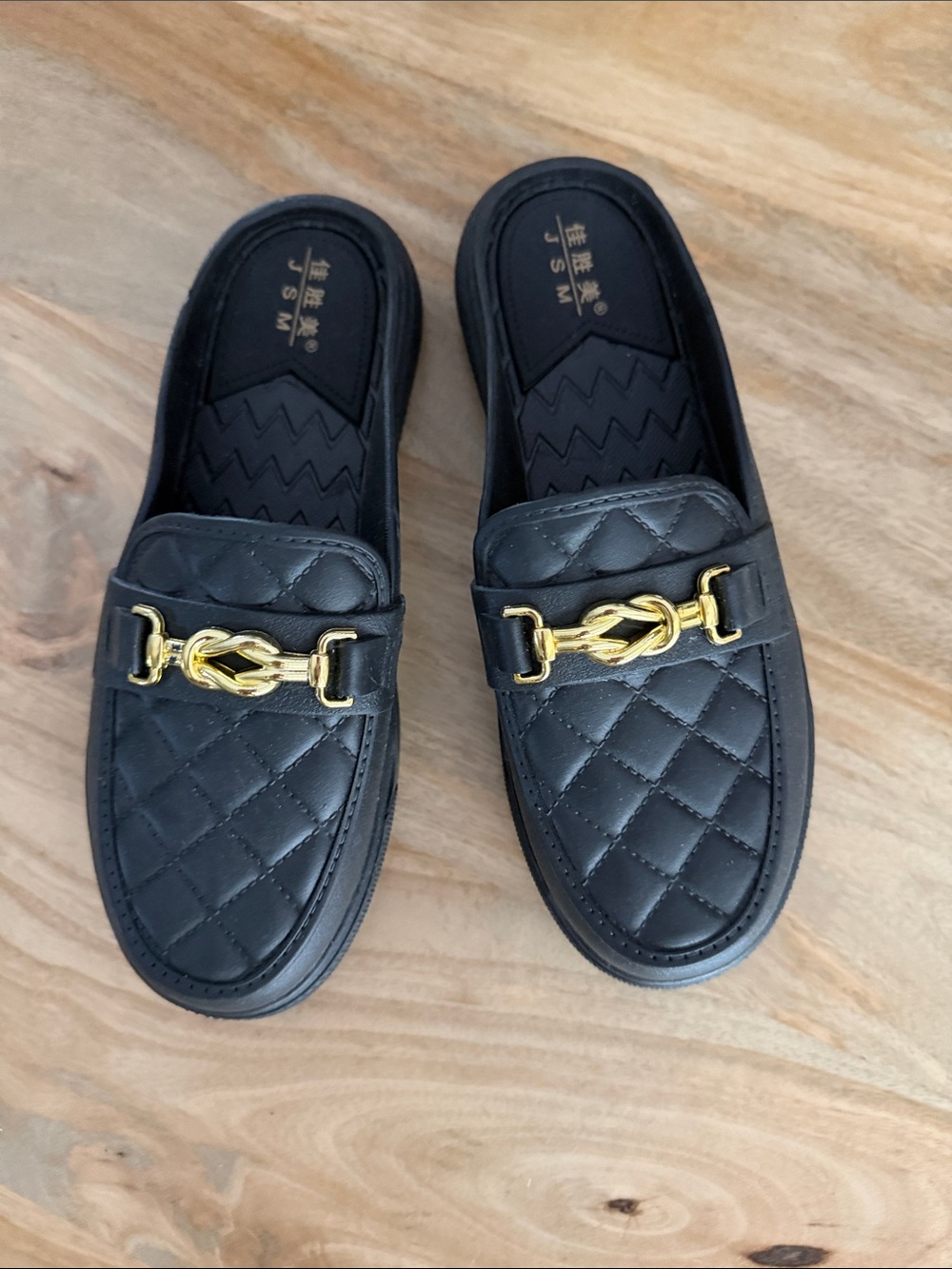 Women's Black Quilted Slip-On Rubber Loafers with Gold Accent